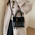 Chic black patchwork bucket bag in matte and polished leather for women - Black with Pendant