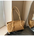 Close-up of caramel quilted pleats on a stylish large PU leather tote bag details - Khaki