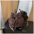 Detail view of large brown vintage backpack with leather buckles and drawstring closure - Brown