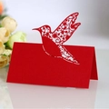 Elegant red laser-cut hummingbird place cards with floral details for wedding tables - Pearlescent Red