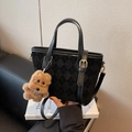 Black quilted suede bucket bag with round logo and cute brown puppy plush keychain - Black with Pendant