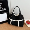 Chic black suede tote bag with white faux fur trim and detachable leather shoulder strap - Black