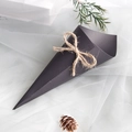 Detail of black kraft paper wedding confetti cone with natural jute rope bow on white mesh - 14.5cm / Black With Rope