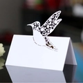Elegant white laser-cut hummingbird place card for wedding table settings and events - White