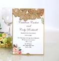 Detail showing laser cut floral wedding invitation with golden hollow out cover and inner card - Beige Gold