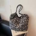 Fashionable leopard print plush tote bag with woven rope handles and brand patch - Leopard Black