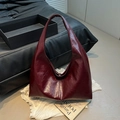 Minimalist deep wine red glossy leather hobo shoulder bag with a vintage slouchy design - Red