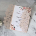 Macro detail of laser-cut champagne gold floral lace wedding invitation with insert - Flesh Pink Full Set