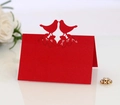 Elegant red laser-cut place card with two birds kissing for wedding table settings - Pearlescent Red