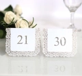 Detailed laser cut white wedding table number cards with elegant lace floral pattern - White Numbered 21-30