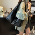 Large black hobo shoulder bag in glossy pleated faux leather for autumn fashion - Black