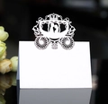 Elegant laser-cut wedding place card with carriage design on a reflective surface - White