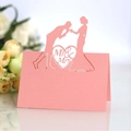 Pink pearlescent laser cut wedding table card featuring romantic Mr & Mrs heart silhouette - Pink