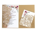 Macro shot of laser-cut rose patterns on kraft paper wedding invitation with floral insert - Beige Gold