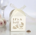 Detail showing laser-cut 'It's A Boy' pattern on cream baby shower gift candy box - Ivory