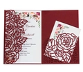 Detail of laser-cut burgundy rose wedding invitation with elegant floral card inserts - Dark Red