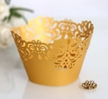 Close-up of golden laser-cut lace cupcake wrappers with intricate floral patterns - 5cm / Gold