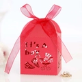 Detail of red laser-cut candy box featuring It's A Boy patterns and matching ribbon bow - Pearlescent Red