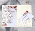 Elegant laser cut wedding invitation set with floral inner card and RSVP on marble surface - Ivory