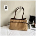 Detail of camel suede tote bag with brown straps styled with laptop for office commute - Khaki