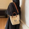 Bolso tote minimalista de lona crema con asas de cuero marrón y correa para el hombro - Caqui