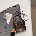 Brown leopard print bucket bag with leather trim and gold hardware details - Coffee No Charm