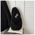 Close-up of black plush shoulder bag with curly faux fur texture on a lifestyle background - Black