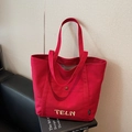 Borsa tote in tela rossa con ricamo TELN, tasche frontali funzionali e chiusura con bottone - Borgogna