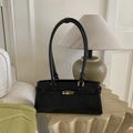 Classic black leather shoulder bag for women with gold clasp in a stylish interior setting - Black without Pendant