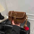 Vintage brown suede shoulder bag with dark leather piping and colorful pompom charm - With Charm / Brown