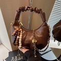 Retro brown dumpling bag with pleated cloud handle, wooden beads and chain strap detail - Brown
