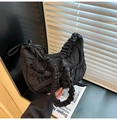 Detail of black pleated crossbody bag with scrunchie strap and ribbon bow decoration - Black