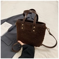 Detail of dark brown faux shearling bucket bag with leather trim and gold studs - Without Charm (ZL-1601) / Brown