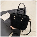 Detail of black faux fur bucket bag with leather handles and gold rivet accents - Without Charm (ZL-1601) / Black