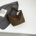 Dark brown suede tote bag with stylish ruched handles and a minimalist bucket design - Brown