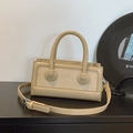 Sac à main chic crème beige avec textures brillantes et mates et poignée ronde rigide - Khaki
