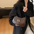 Chic dark brown faux leather underarm bag with glossy finish and gold metal buckle - Brown