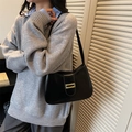 Chic black half-moon shoulder bag in smooth faux leather with gold metallic buckle - Black
