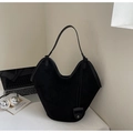 Close-up of a black vintage oversized tote bag with matte texture and long shoulder straps - Black