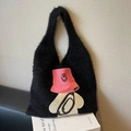 Black fluffy plush tote bag with a cartoon character patch and spacious interior design - Black