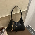 Chic black leather hobo shoulder bag with vintage gold hardware and wood bead charms - Black with Pendant