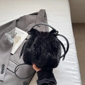 Chic black plush bucket bag with leather drawstring and elegant silver metal details - Black