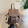 Brown vintage drawstring backpack for women featuring matte texture and beaded detail - Brown