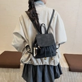 Mini black backpack in faux suede with enjoy chan rab embossing and beaded pendant - Black