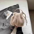 Chic apricot faux mink fur drawstring bucket bag with leather strap on grey blazer - Khaki