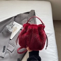 Deep red faux fur bucket bag with leather handle and drawstring closure for women - Burgundy