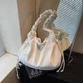 White corduroy drawstring shoulder bag with pleated handle and minimalist ruched design - Off White