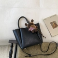Black lychee leather bucket bag with a brown plush bear charm and crossbody strap - With Plush Bear Pendant / Black