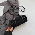 Minimalist black bowling bag in matte finish with leather straps and silver metal buckles - Black