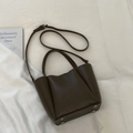 Dark brown leather bucket bag with handle and adjustable shoulder strap in minimalist style - No Pendant / Cocoa